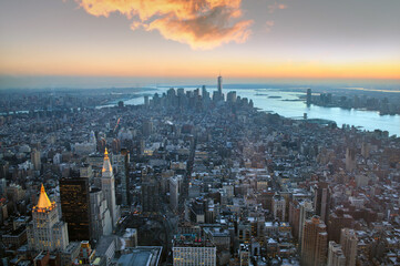 Manhattan skyscrapers high rise buildings in Midtown Manhattan and the East River, aerial view in...
