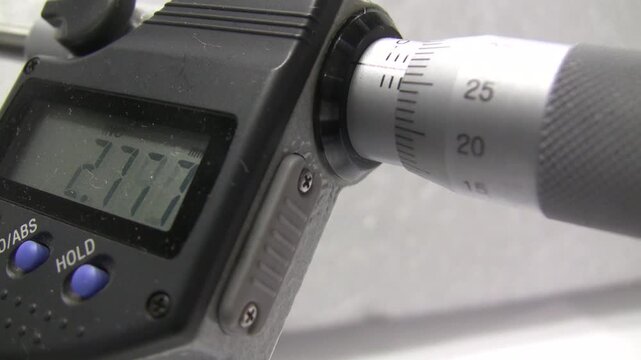 Measuring micrometer. Industrial measuring tool. Micrometers Mitutoyo. Wire measurement