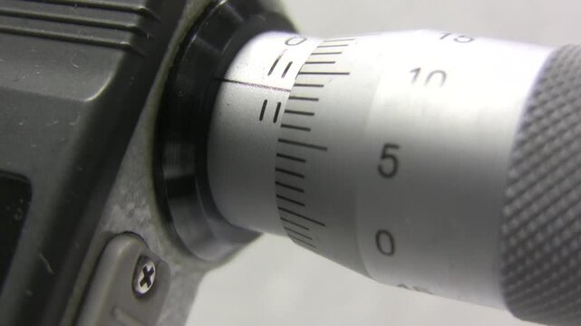 Measuring micrometer. Industrial measuring tool. Micrometers Mitutoyo. Wire measurement