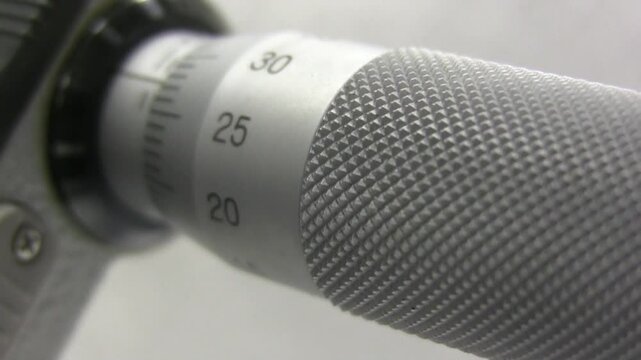 Measuring micrometer. Industrial measuring tool. Micrometers Mitutoyo. Wire measurement