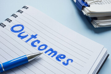 Notebook with notes about outcomes. Performance evaluation and strategic planning.