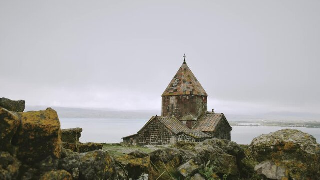 Timelapse Sevanavank monastic complex building with Sevan lake view. Peninsula at the northwestern shore of Lake Sevan in the Gegharkunik Province of Armenia. Popular travel sightseeing attraction