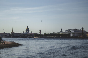 A view of the river, and in the distance is a town.