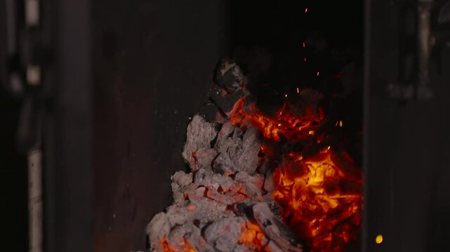 Fireplace charcoal sparks emers pan shot