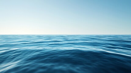 Fototapeta premium A serene view of a calm ocean under a clear blue sky, evoking tranquility and relaxation.