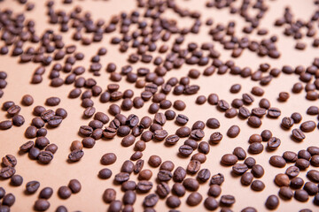 
Top view background of aromatic brown coffee beans scattered on surface
