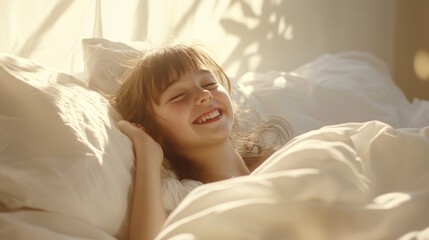 Young girl waking up and smiling in bed surrounded by soft morning light enjoying a new day with excitement