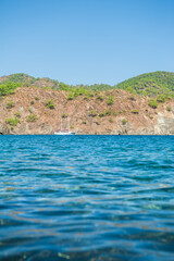 Serene view of a yacht on the open turquoise sea