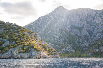 Breathtaking coastal landscape with turquoise waters and pine-covered mountains