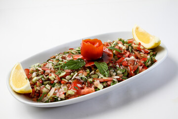 Turkish kebab salad mixed salad plate. onion, tomato, pepper, parsley and spices