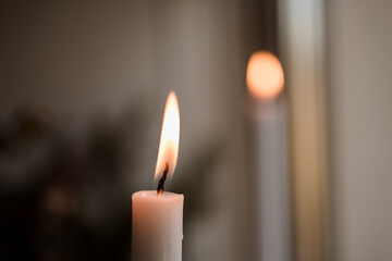 burning candle in the dark