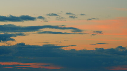 Obraz premium Summer sunset sky. Purple sky clouds afterglow dusk evening. Timelapse.