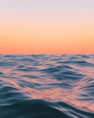 Fototapeta premium Mesmerizing vast open ocean reflecting twilight hues in a scene of ultimate tranquility and beauty.