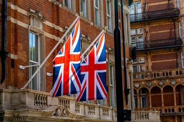 Union Jack Flags On The Side Of A Building To Show A British Residence Or Pride