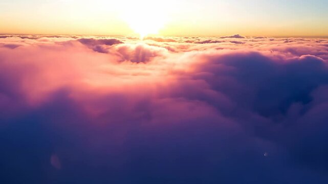 Aerial Exploration of Sunset's Pink Clouds: Flying Over the Cloudline, Embracing the Fairy Tale Mood and Capturing a Beautiful Rosy Landscape in the Sky