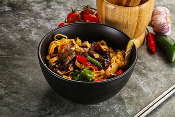 Asian wok with noodle, vegetables and beef