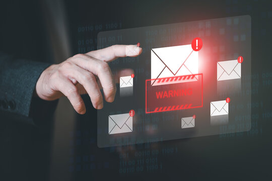 Business man using smartphone and computer that show warning sign after got attack phishing email by malware from hacker that commit cyber crime or software crash to cause an error.