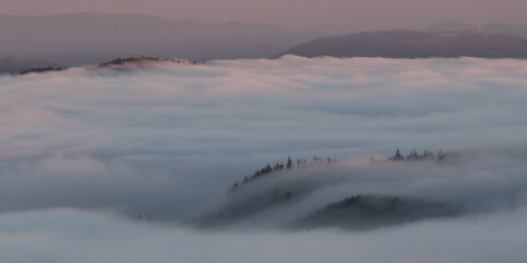 Sunset in the Teplice-Adršpašské rocks. The sun is low on the horizon and the inverted clouds...