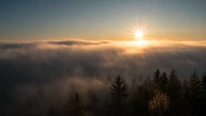 Sunset in the Teplice-Adršpašské rocks. The sun is low on the horizon and the inverted clouds create stunning scenery that makes it seem as if you are above the clouds.