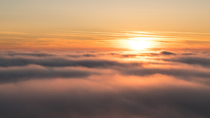 Sunset in the Teplice-Adršpašské rocks. The sun is low on the horizon and the inverted clouds create stunning scenery that makes it seem as if you are above the clouds.