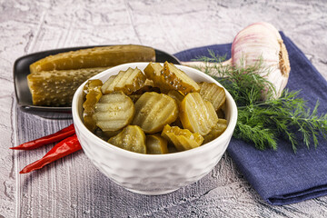 Sliced marinated cucumbers in the bowl