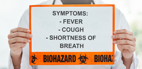 Doctor, hands and poster with covid symptoms for illness, virus or pandemic biohazard at hospital. Closeup, medical professional or healthcare employee with sign for fever, cough or breath at clinic