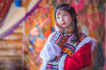 Portrait Fashion of the Asian Tourist young girl wearing traditional Tibetan clothing costume...