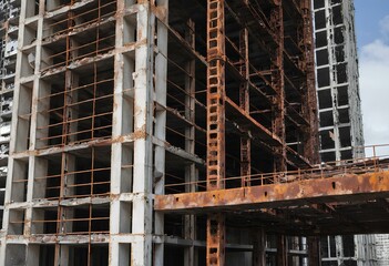 Tall buildings that are not yet completed It had a bare metal frame and severely rusted beams. It indicates years of neglect.