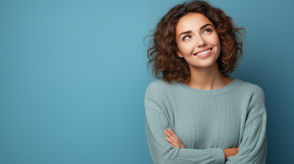 Obraz premium Portrait of a beautiful young woman smiling and looking at camera. Woman portrait