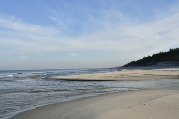 Tranquil Sandy Beach with Blue Sky