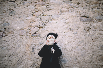 Woman with open Eyes, Hair as Veil, Against Wall
