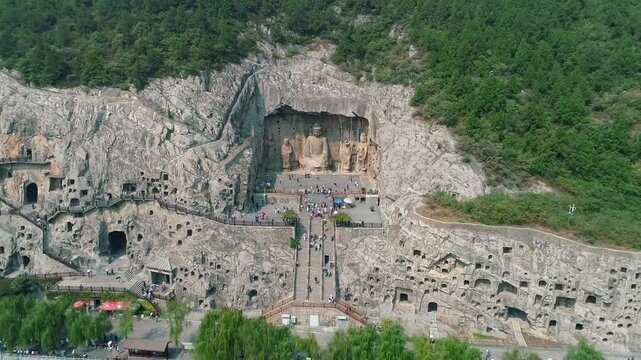 Aerial drone view of Longmen Grottoes Caves Yi River Luoyang in Henan province, China. Chinese Buddhist art Longmen Caves. Longmen Grottoes Caves in Luoyang, China.