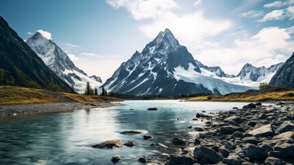 Tranquil glacier lake with clear, calm waters and towering mountains in the background.