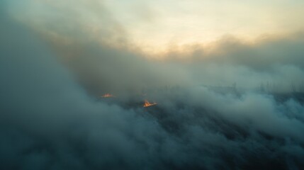 The sky is filled with smoke and the sun is setting
