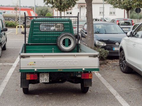 Green Ape piaggio cargo van scooter porter pickup truck parked in parking lot