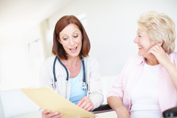 Happy women, doctor or patient with prescription for elderly care, consultation or medical history at clinic. Healthcare, worker or employee talking to senior person with a disability for insurance