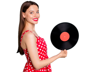 Portrait of lovely girl holding vinyl record disc smiling wearing dotted dresss skirt isolated over green teal turquoise background