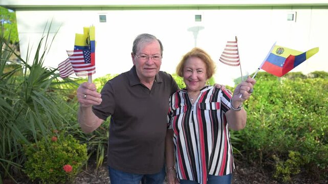 Venezuelan Americans celebrate by waving Venezuelan and American flags