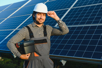 Solar panel technician installing solar panels on a sunny day