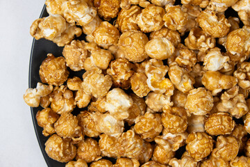 Sweet caramelized popcorn top view close up