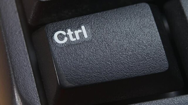 Ctrl Key or Control Key on Desktop Keyboard Pressed by Finger Hand Multiple Times - Close Up Macro Shot