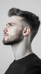 Obraz premium A man with a shaved head and a beard