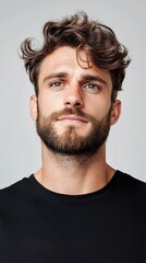 Fototapeta premium A man with a beard and a black shirt