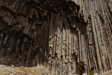 Stunning Armenian geological formation with unique basalt columns in natural sunlight