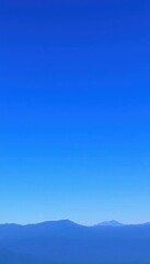 a mountain range with a clear blue sky