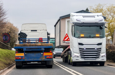 A Lorry Carrying A Static Caravan Home To It's Next Location And New Customer