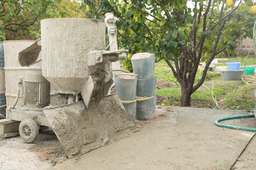 Concrete with cement mixer machine at construction site.