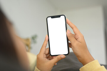 Close up person holding smartphone with white screen for app display