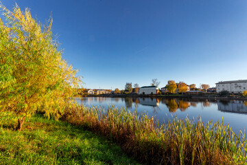 Fototapeta premium Bogorodsk, Nizhny Novgorod region, Russia, Street view of an ancient provincial Russian city on the shore of a lake on a summer evening. An ancient building of artisans, an architectural monument.