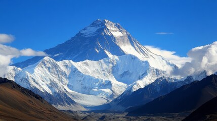 Obraz premium Mount Everest, the world's highest peak, stands majestically alone against a pristine white background, its towering silhouette piercing the heavens.